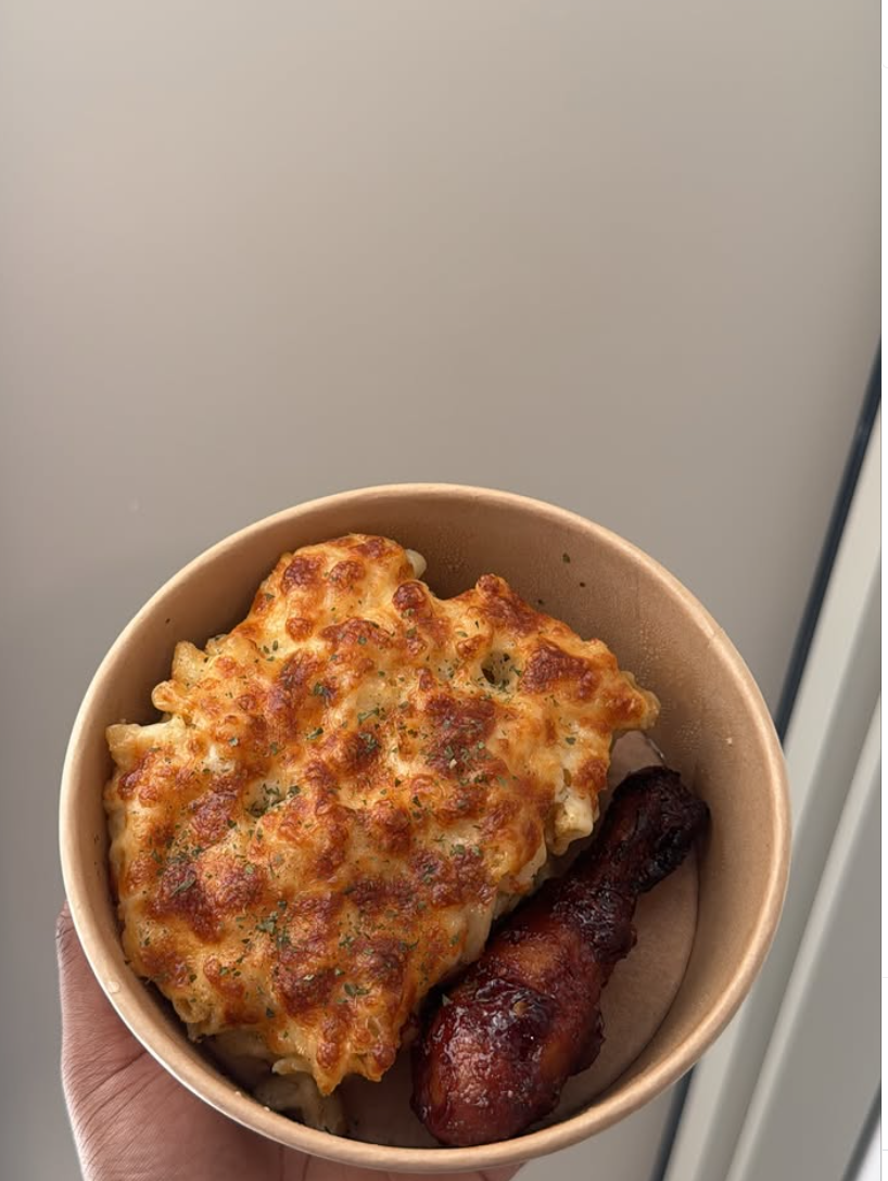 Baked mac and cheese with glazed chicken drumstick