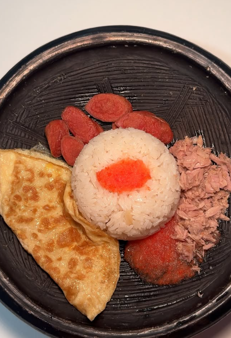 Breakfast plate with rice, stew, sausage, omelette and tuna
