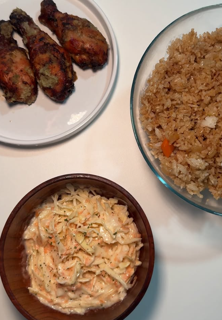 Grilled chicken, fried rice and coleslaw served in bowls by The Juls Cuisine